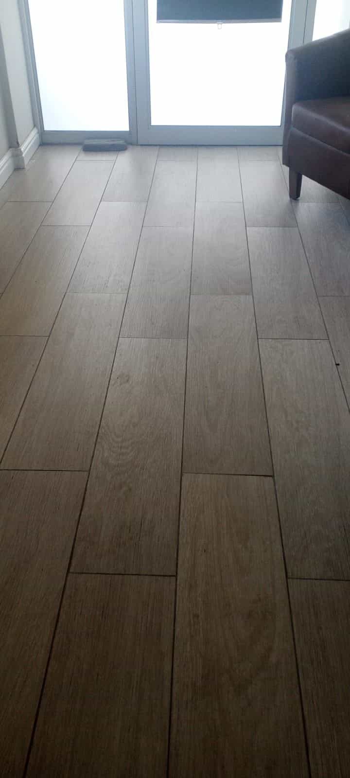 Wood-look plank floor tiles laid by Elite Home Finishes