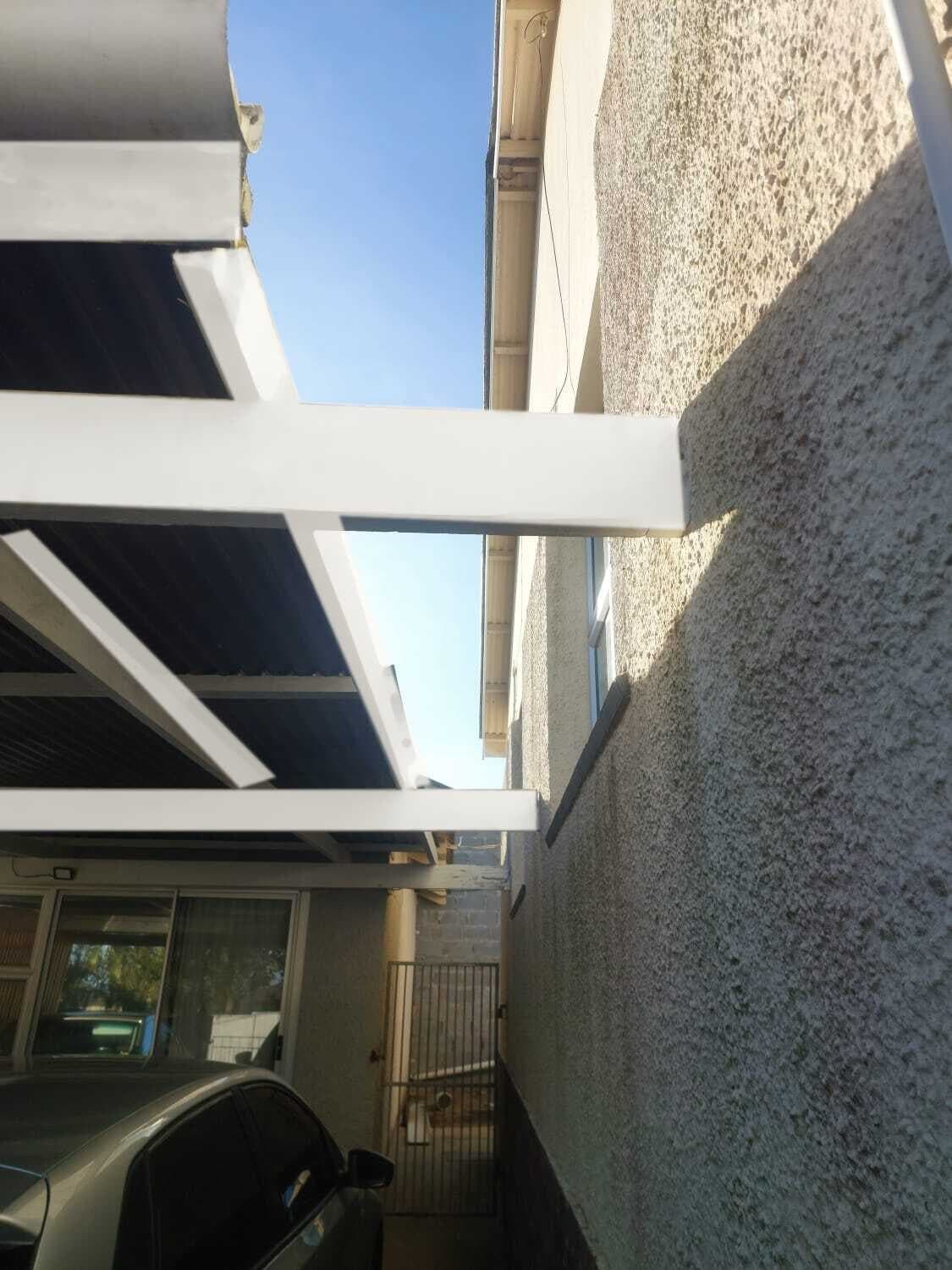 Carport beam fixed to the house wall