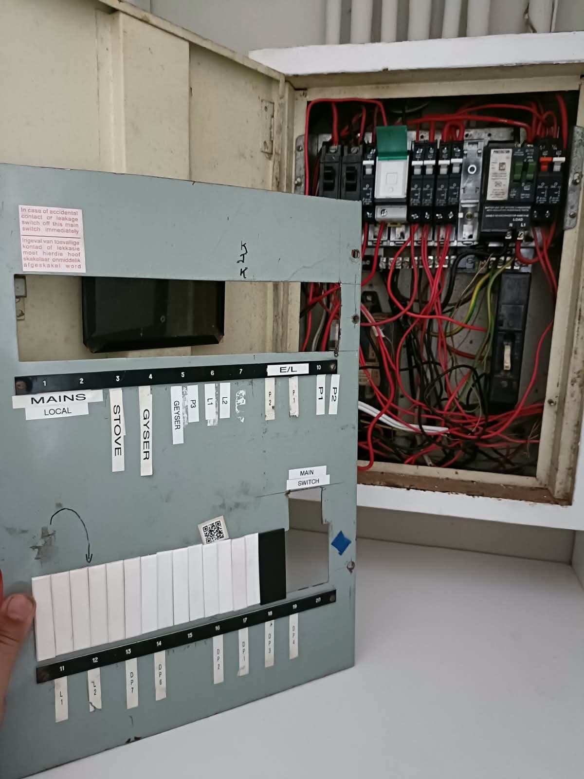 Same distribution board with a new labelled cover plate fitted by Elite Home Finishes