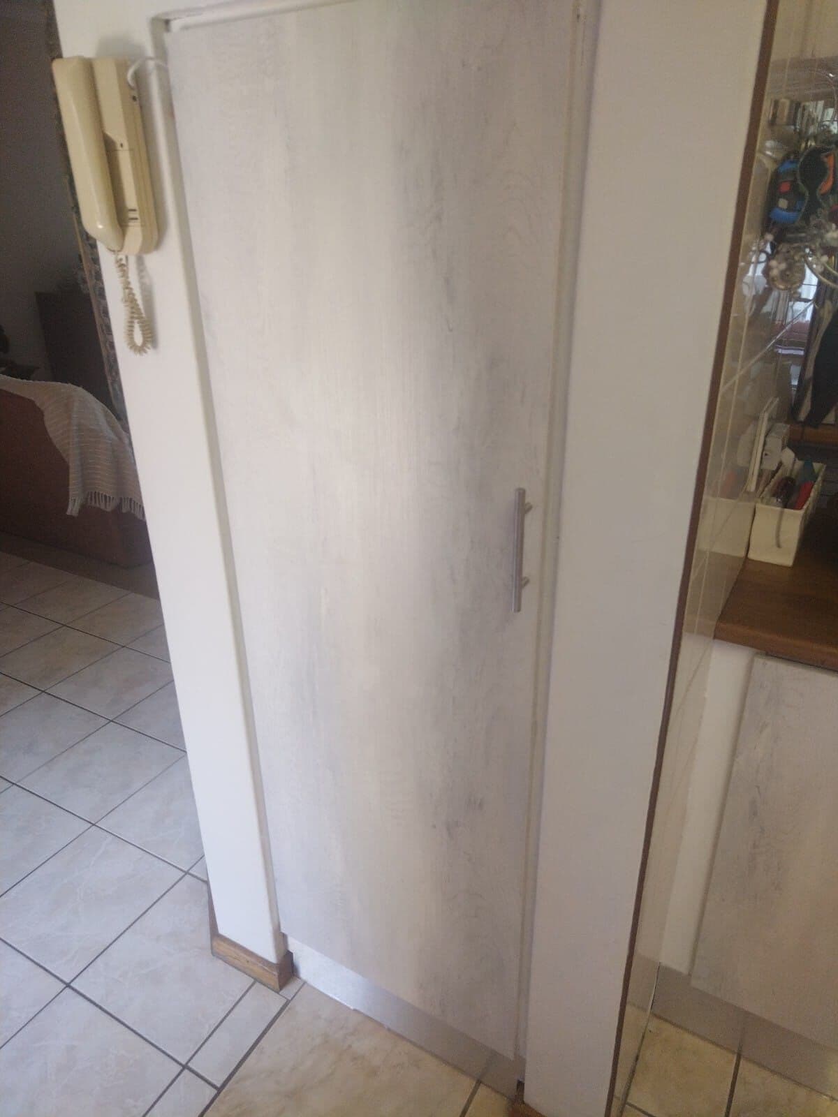 Tall whitewash pantry cupboard fitted floor to ceiling